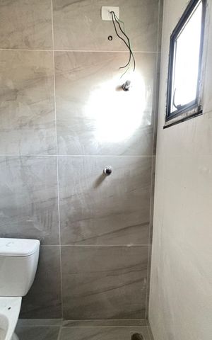 Casa à venda com 70m², 2 quartos e 2 vagas Casa à venda com 70m², 2 quartos e 2 vagasBanheiro da Suíte 2