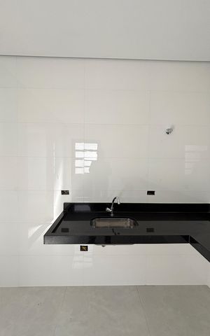 Casa à venda com 95m², 3 quartos e 2 vagas Casa à venda com 95m², 3 quartos e 2 vagasCozinha