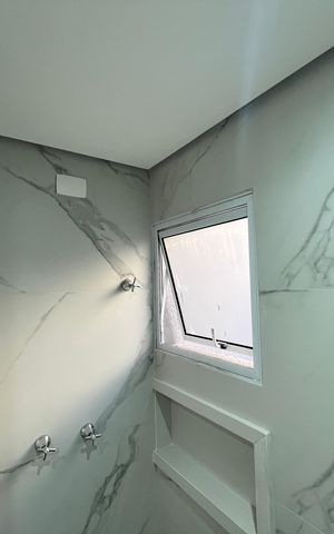 Casa de condomínio à venda com 124m², 3 quartos e 2 vagasBanheiro da Suíte