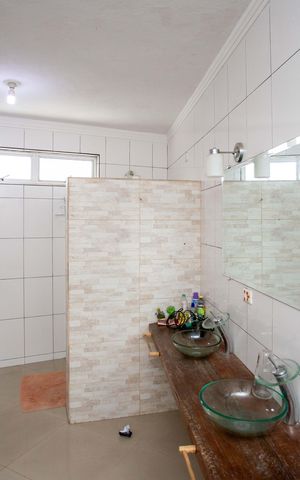Casa à venda com 272m², 4 quartos e 3 vagasBanheiro da Suíte