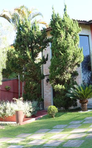 Casa de condomínio para alugar com 323m², 4 quartos e 5 vagasFachada