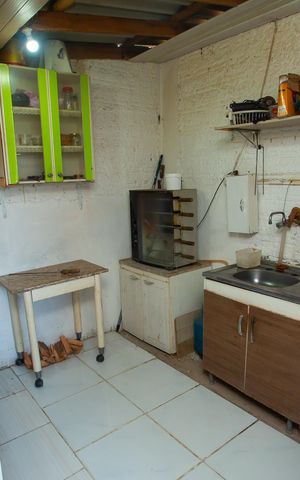 Casa à venda com 80m², 2 quartos e 1 vaga Casa à venda com 80m², 2 quartos e 1 vagaCozinha externa