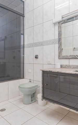 Casa à venda com 410m², 4 quartos e 8 vagasBanheiro da Suíte 3