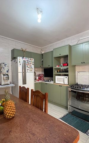 Casa à venda com 147m², 3 quartos e 3 vagas Casa à venda com 147m², 3 quartos e 3 vagasCozinha