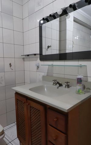 Casa à venda com 400m², 6 quartos e 3 vagasBanheiro da Suíte 1