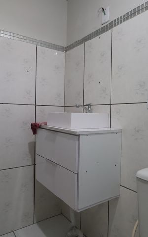 Casa à venda com 130m², 4 quartos e 2 vagasBanheiro/casa fundos