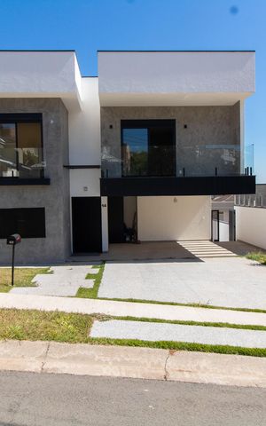 Casa de condomínio à venda com 411m², 4 quartos e 4 vagas Casa de condomínio à venda com 411m², 4 quartos e 4 vagasFachada