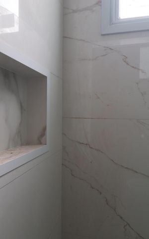 Casa de condomínio à venda com 117m², 2 quartos e 2 vagasBanheiro da Suíte 1