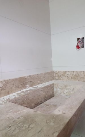 Casa de condomínio à venda com 117m², 2 quartos e 2 vagasBanheiro da Suíte 1