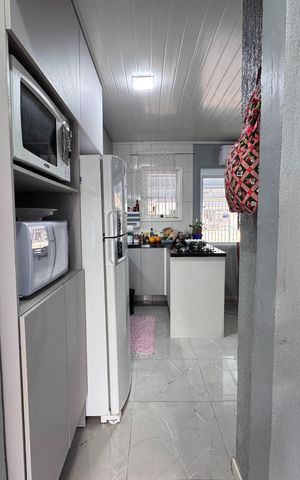 Casa à venda com 44m², 2 quartos e 2 vagas Casa à venda com 44m², 2 quartos e 2 vagasCozinha