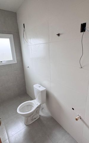 Casa à venda com 62m², 2 quartos e 2 vagas Casa à venda com 62m², 2 quartos e 2 vagasBanheiro da Suíte