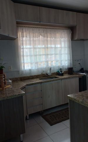 Casa à venda com 110m², 3 quartos e 2 vagas Casa à venda com 110m², 3 quartos e 2 vagasCozinha