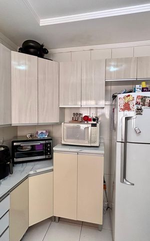 Casa à venda com 107m², 3 quartos e 2 vagas Casa à venda com 107m², 3 quartos e 2 vagasCozinha