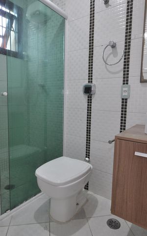 Casa de condomínio para alugar com 123m², 3 quartos e 2 vagasBanheiro da Suíte 2
