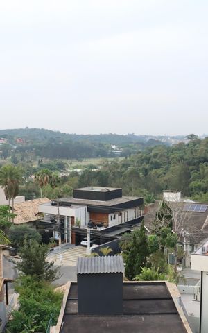 Casa de condomínio para alugar com 484m², 4 quartos e 3 vagasVista da Varanda da Suíte 1