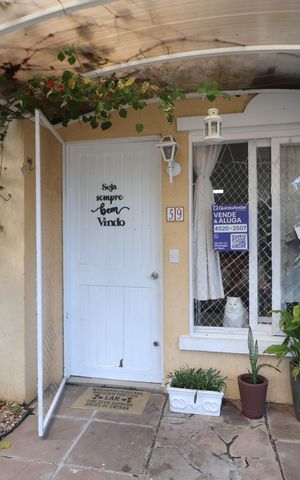 Casa de condomínio à venda com 81m², 3 quartos e 2 vagasFachada da casa