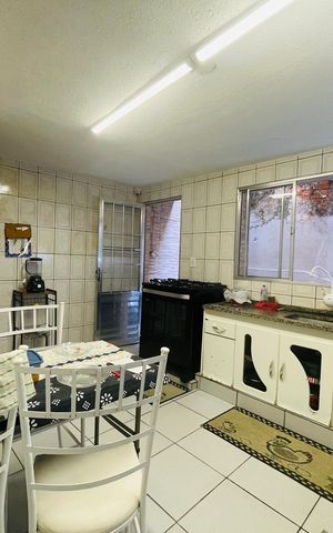 Casa à venda com 125m², 2 quartos e 2 vagas Casa à venda com 125m², 2 quartos e 2 vagasCozinha