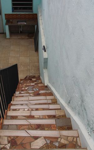 Casa à venda com 310m², 3 quartos e sem vagaEscada acessoa a Varanda