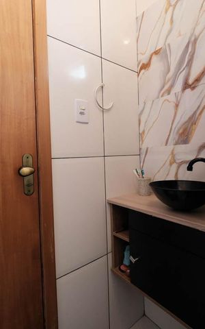 Casa de condomínio à venda com 58m², 2 quartos e 1 vagaSuíte 1