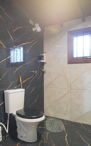 Casa à venda com 120m², 3 quartos e 3 vagasBanheiro da Suíte 1