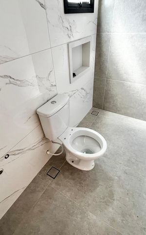 Casa à venda com 140m², 4 quartos e 2 vagas Casa à venda com 140m², 4 quartos e 2 vagasBanheiro da Suíte 1