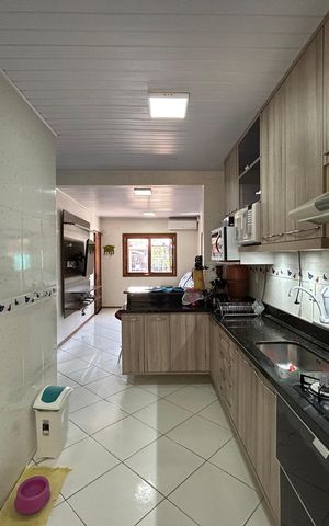 Casa à venda com 59m², 2 quartos e 2 vagas Casa à venda com 59m², 2 quartos e 2 vagasCozinha