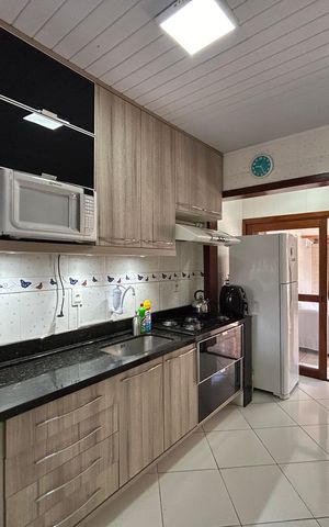 Casa à venda com 59m², 2 quartos e 2 vagas Casa à venda com 59m², 2 quartos e 2 vagasCozinha