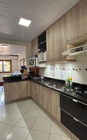 Casa à venda com 59m², 2 quartos e 2 vagas Casa à venda com 59m², 2 quartos e 2 vagasCozinha