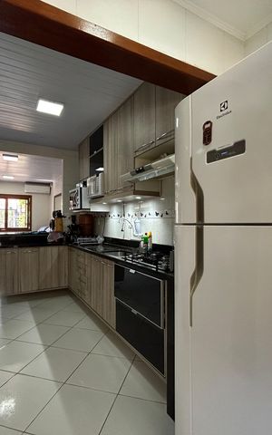 Casa à venda com 59m², 2 quartos e 2 vagas Casa à venda com 59m², 2 quartos e 2 vagasCozinha