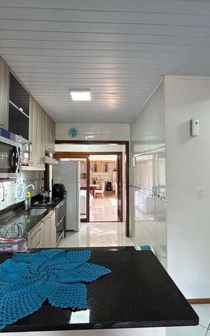 Casa à venda com 59m², 2 quartos e 2 vagas Casa à venda com 59m², 2 quartos e 2 vagasCozinha
