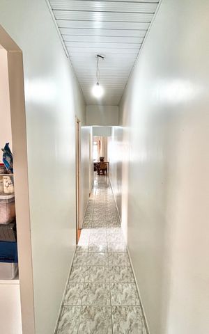 Casa à venda com 125m², 3 quartos e 2 vagas Casa à venda com 125m², 3 quartos e 2 vagasCorredor