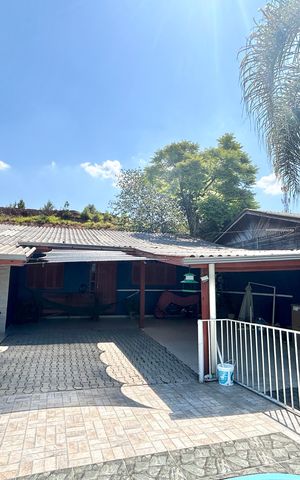 Casa à venda com 113m², 3 quartos e 2 vagas Casa à venda com 113m², 3 quartos e 2 vagasFachada