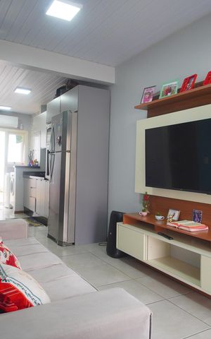 Casa de condomínio à venda com 48m², 2 quartos e 2 vagasSala