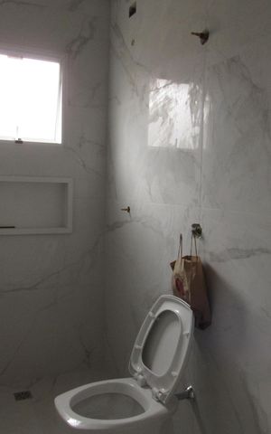 Casa à venda com 140m², 3 quartos e 4 vagasBanheiro da Suíte 1