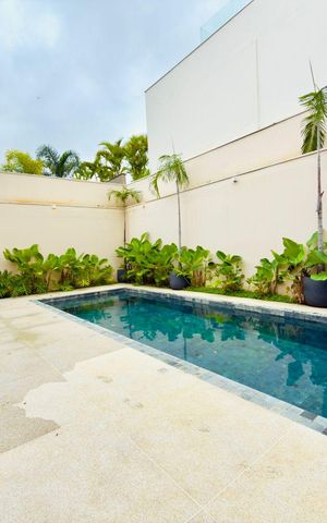 Casa de condomínio à venda com 385m², 4 quartos e 4 vagas Casa de condomínio à venda com 385m², 4 quartos e 4 vagasÁrea externa