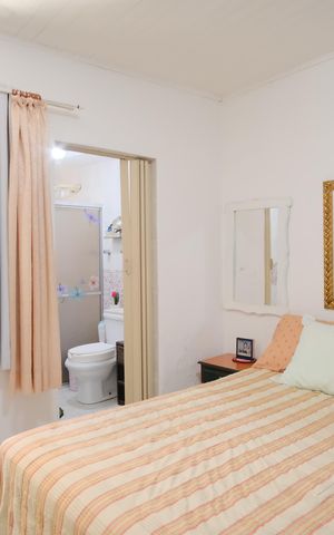 Casa à venda com 450m², 7 quartos e 6 vagasSuíte 1 da Casa 1