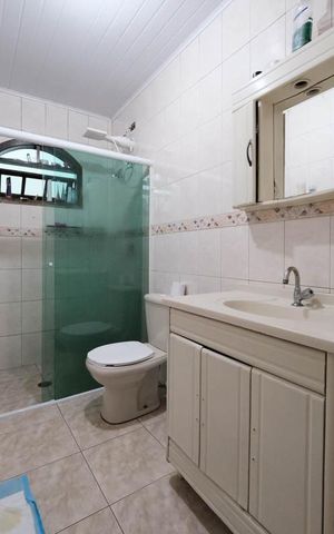 Casa à venda com 128m², 3 quartos e 3 vagasBanheiro 1