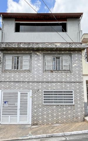 Casa à venda com 210m², 4 quartos e 2 vagasFachada + plaquinha