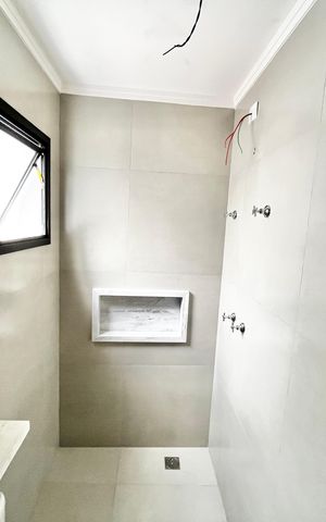 Casa à venda com 70m², 2 quartos e 2 vagas Casa à venda com 70m², 2 quartos e 2 vagasBanheiro da Suíte 1