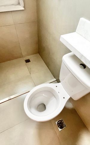 Casa à venda com 70m², 2 quartos e 2 vagas Casa à venda com 70m², 2 quartos e 2 vagasBanheiro da Suíte 2