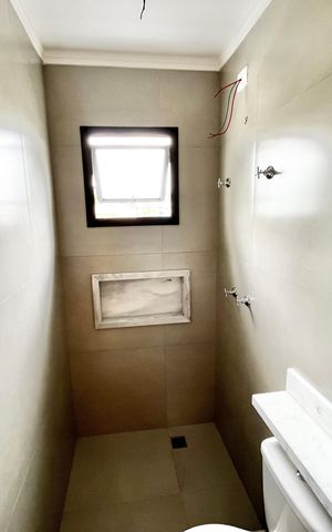 Casa à venda com 70m², 2 quartos e 2 vagas Casa à venda com 70m², 2 quartos e 2 vagasBanheiro da Suíte 2
