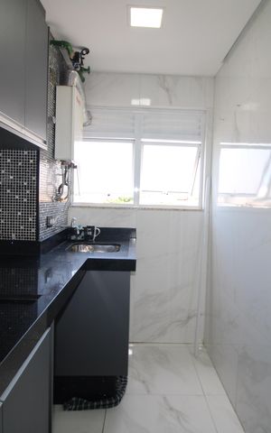 Apartamento à venda com 55m², 2 quartos e 2 vagasSala / Cozinha
