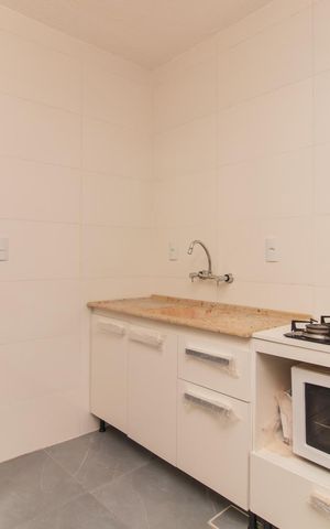 Casa de condomínio à venda com 65m², 2 quartos e sem vagaCozinha e Área de Serviço