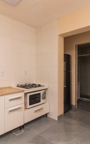 Casa de condomínio à venda com 65m², 2 quartos e sem vagaCozinha e Área de Serviço