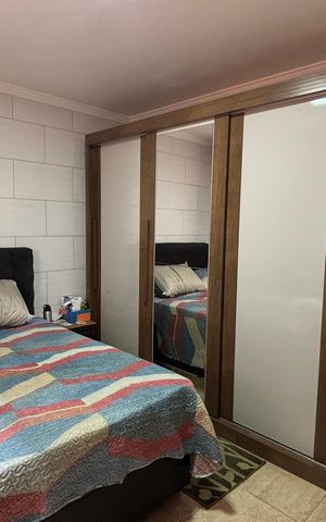 Casa à venda com 100m², 2 quartos e 2 vagas Casa à venda com 100m², 2 quartos e 2 vagasQuarto 1