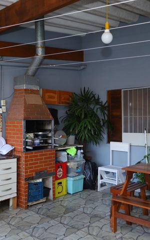 Casa à venda com 103m², 2 quartos e 2 vagasVaranda e área da churrasqueira