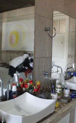 Casa de condomínio para alugar com 200m², 4 quartos e 5 vagasBanheiro da Suíte 1