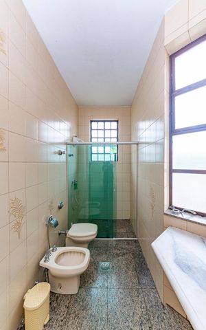Casa à venda com 309m², 4 quartos e 3 vagasBanheiro da Suíte