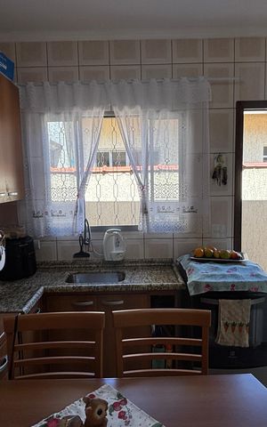 Casa à venda com 68m², 2 quartos e 2 vagas Casa à venda com 68m², 2 quartos e 2 vagasCozinha