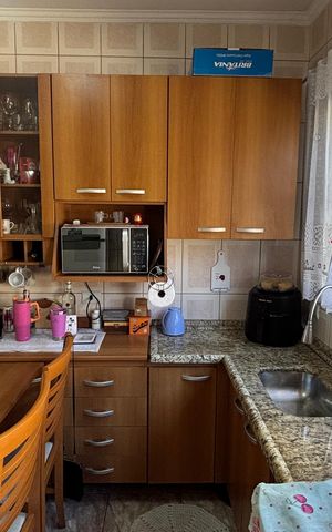 Casa à venda com 68m², 2 quartos e 2 vagas Casa à venda com 68m², 2 quartos e 2 vagasCozinha